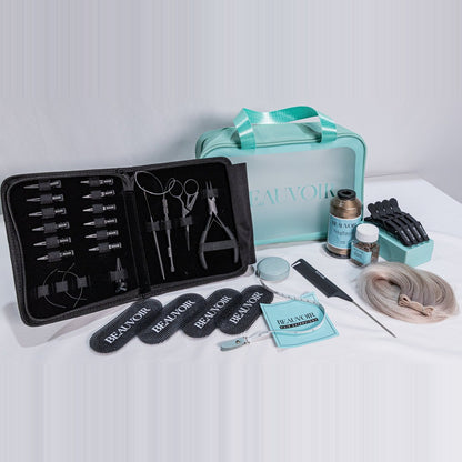 Beauvoir Installation Kit: open tool case with pliers, scissors and loops, teal Beauvoir bag, nylon thread, beads, clips, comb, tape measure and practice hair